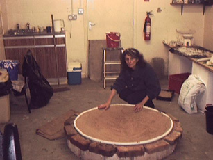 shows Rita with the upturned mould of the plaster font