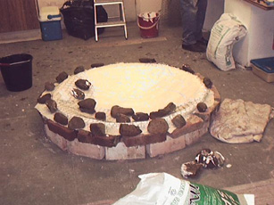 shows the upturned mould of the plaster font