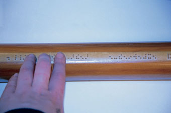 Close up of hand reading rail