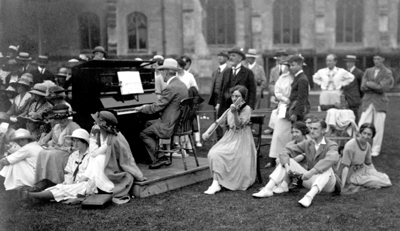 Black and white photograph of musicians playing outside for folk dancing