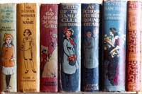 Colour photograph showing some of Oxenham's books on a shelf